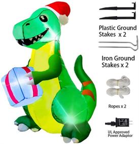 img 1 attached to 🦖 Yostyle 5Ft Tall Green Dinosaur Inflatable Christmas Decorations, Outdoor Christmas Blow up Decor with Hat, Present, and LED Lights for Holiday Yard Garden Lawn