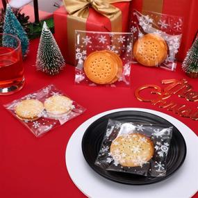 img 1 attached to 🍪 200 Christmas Cookie Bags Snowflake Clear Treat Bags for Gifts and Goodies - Self Adhesive Seal (4 by 4 Inch)