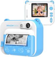 📸 dragon touch instantfun instant print camera for kids - blue: zero ink toy camera with print paper, cartoon sticker, color pencils - portable digital creative camera for boys and girls logo