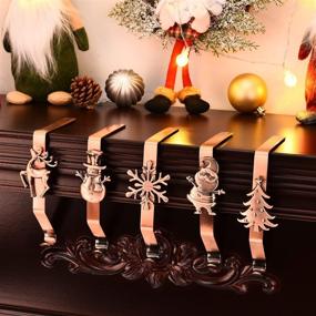 img 1 attached to 🎄 Enhance Your Christmas Decor with Yuokwer Pack of 5 Snowflake Christmas Stocking Hangers - Festive Fireplace Stocking Holders in Red Copper (Pack of 5)