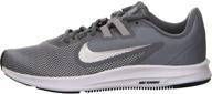 enhance your active stride with nike women's downshifter 9 sneaker logo