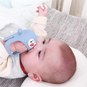 img 2 attached to 🐧 Silicone Baby Teething Toy - Smily Mia Penguin Buddy, Never-Drop Chew Toy for 0-6 Month Infants, Sucking Needs, Hand Pacifier for Breastfeeding Babies, Car Seat Toy for Newborn, Light Blue
