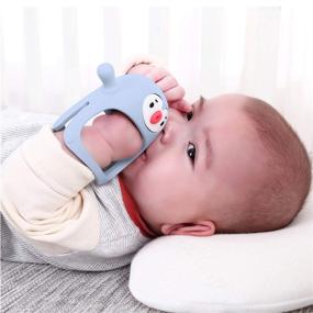 img 3 attached to 🐧 Silicone Baby Teething Toy - Smily Mia Penguin Buddy, Never-Drop Chew Toy for 0-6 Month Infants, Sucking Needs, Hand Pacifier for Breastfeeding Babies, Car Seat Toy for Newborn, Light Blue