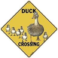 🦆 bold and vivid: crossings duck crossing caution yellow sign delivers safety message loud and clear logo