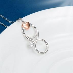 img 2 attached to 🩺 STROLLGIRL Sterling Silver Stethoscope Pendant Necklace - Cubic Zirconia Infinity Loop with Heart for Medical Professionals, Nurses, and Students