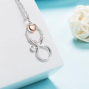 img 1 attached to 🩺 STROLLGIRL Sterling Silver Stethoscope Pendant Necklace - Cubic Zirconia Infinity Loop with Heart for Medical Professionals, Nurses, and Students