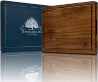 🔪 the blue oak company acacia wood premium large reversible cutting board with juice groove, cracker holder - ideal for chopping, charcuterie, cheese logo