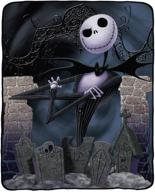 nightmare before christmas super plush throw: 46x60-inch jack's graveyard night king - cozy up in spooky style! logo