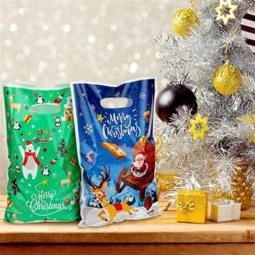 img 2 attached to 🎅 Festive 100-Piece Christmas Plastic Bags for Party Favors: Snowman, Elk, Santa, and Christmas Tree Treat Bags, Candy Bags, Goody Bags - Ideal for Christmas Party Favor or Trick-or-Treating