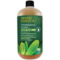 desert essence thoroughly clean face wash - original - 32 fl oz - tea tree 🌿 oil - gentle cleanser - promotes soft radiant skin - enriched with goldenseal, awapuhi, and chamomile essential oils logo