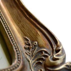 img 1 attached to 🖼️ SIKOO Vintage Picture Frame - Antique Ornate Photo Frame for Home Decor, Photo Gallery, and Art - Tabletop and Wall Hanging with High Definition Glass Front (5x7, Bronze Gold)