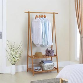 img 3 attached to Finnhomy Extra Large Bamboo Clothes Rack: Portable Garment Rack with 2-Tier Storage Box Shelves for Entryway and Bedroom - Patented Design