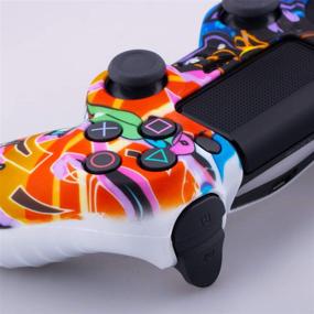 img 1 attached to 9CDeer PS4 Controller Protective Cover: Silicone Skin + Thumb Grips & Dust Proof Plugs – Cartoon Paint Design