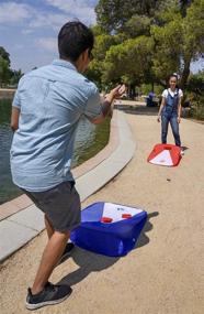 img 1 attached to Portable Cornhole Game Set for Kids - Beach Corn Hole Tailgate Game - Collapsible Outdoor Bean Bag Toss Game for Backyard, Lawn, and Travel