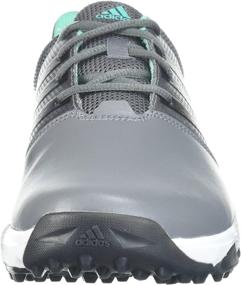 img 3 attached to Обувь Adidas Traxion в белом и черном цветах - превосходное сцепление для спортивной производительности.