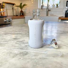 img 2 attached to 🌍 Safeguard Your Bottles with SAVVY PLANET Silicone Protection: Must-Have Travel Accessories