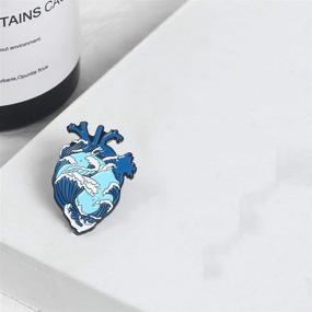 img 2 attached to 🌊 ROSTIVO Blue Ocean Waves Heart Enamel Pin for Backpacks: Stylish Pins for Men, Women, Boys & Girls - Ideal for Hat or Bag
