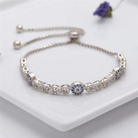 img 2 attached to 👁️ Stunning Evil Eye Bracelet: Intricate Infinity Symbols, Sterling Silver, Adjustable Slider, Blue & White Cubic Zirconia - Perfect silver bracelet for women