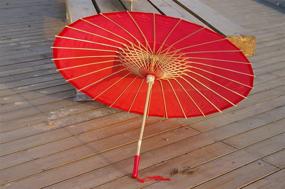 img 1 attached to Stylish and Sustainable Red Bamboo Parasol Umbrella - Perfect for Weddings and Events