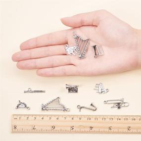 img 1 attached to 🎵 PH PandaHall 90pcs Tibetan Music Charms Set – 15 Musical Instrument Notes Symbols, including Piano and Violin Beads Pendants for DIY Bracelet Necklace Jewelry Making