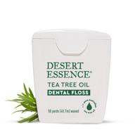 desert essence tea tree oil dental floss - 50 yards - naturally waxed w/ beeswax - shred-free thick floss for effective on-the-go cleaning - cruelty-free & antiseptic power to remove food debris buildup logo