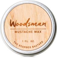 woodsman mustache wax: 1oz tin for strong all day hold, enriched with beeswax, lanolin, and jojoba oil. premium men's care for great smelling facial hair products logo