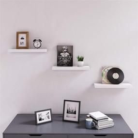 img 2 attached to SONGMICS White Floating Wall Shelf 15.7 inch - Easy Installation for Decorative Display in Corners with Invisible Bracket Support (ULWS14WT)