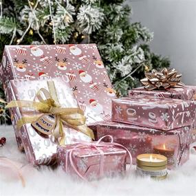 img 1 attached to 🎁 LeZakaa Pink Metallic Christmas Wrapping Paper Roll - Snowflakes/Santa Claus/&#34;HO&#34; Print - 3 Rolls, 17 x 120 in - Ideal for Gift Wrap, Arts Crafts - 42.5 sq.ft.ttl.