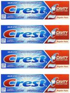 🦷 crest cavity protection regular paste toothpaste, 0.85 oz travel size (pack of 4) with fluoride for anticavity care logo