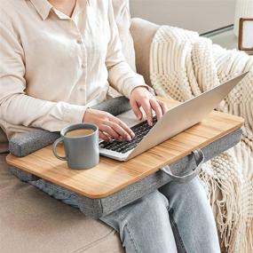 img 3 attached to SONGMICS Lap Desk: Portable Laptop Table for 15.6 Inch Laptops with Handle, Cushion, and Phone/Tablet Slot - Natural ULLD107N01