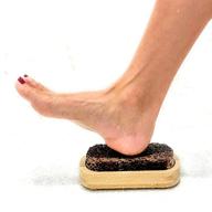 👣 pumice stone foot scrubber: exfoliate, massage, and clean feet - for shower floor - suctions to shower & bath - dead skin & callus removal - men and women logo