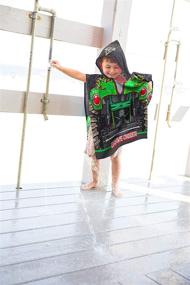 img 1 attached to Monster Jam Grave Digger Kids Hooded Poncho Towel - Super Soft & Absorbent, Ideal for Bath, Pool, and Beach, Official Monster Jam Product