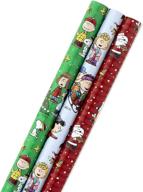 hallmark christmas peanuts wrapping paper pack - snoopy, charlie brown, woodstock, 3 rolls (105 sq. ft. total) - with reverse cut lines logo