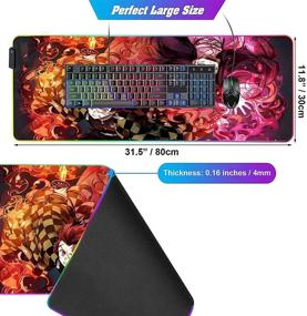 img 2 attached to 🐇 Vibrant RGB Anime Mouse Pad featuring Demon Slayer Tanjiro and Nezuko - Extra Large Size for Perfect Gaming Setup, with Stitched Edge Frame & Non-Slip Rubber Base - Glowing Desk Pad for Laptop, Keyboard, and Mice - 31.5X11.8 inches