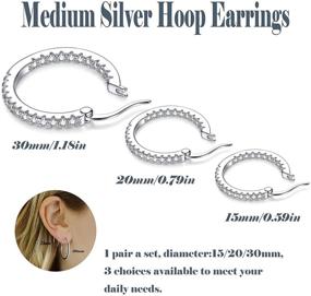 img 2 attached to Hypoallergenic Small Medium CZ Hoop Earrings for Women, Men & Girls - Silver Huggie Hoop Earrings with Cubic Zirconia for Cartilage Piercings - Available in 15mm, 20mm, and 30mm sizes