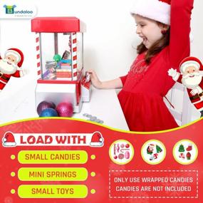 img 1 attached to Christmas Themed Vending Machine Dispenser With 30 Reusable Tokens For Toys, Candy & Prizes - Bundaloo Santa Claw Arcade Game Holiday & Birthday Gift For Kids
