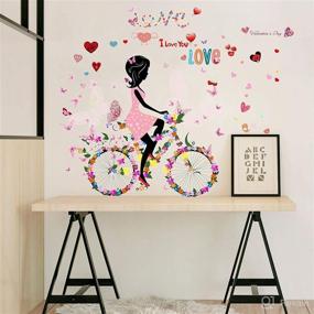 img 2 attached to 🌸 Colorful Loving Hearts Flowers & Butterflies Girl Riding Bicycle Butterfly Wall Decal - Peel and Stick Removable Flower Fairy Wall Stickers Mural for Girls Nursery Bedroom Living Room