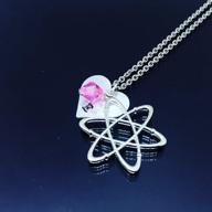 personalized atom science necklace with heart initial charm and birthstone - ideal gift for scientists, chemistry graduates, and proton-electron enthusiasts logo