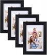 set of 4 black picture frames, holds 4x6 photos with or without 3.5x5 mats, perfect for wall or tabletop display, from giftgarden logo