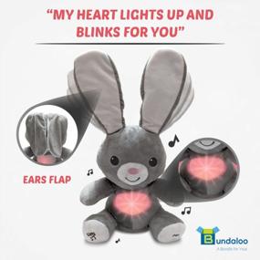 img 1 attached to Bundaloo Peek-A-Boo Bunny Animated Musical Plush Toy - Moving Floppy Ears & Glowing Heart - Plays Peek-A-Boo & Sing Do Your Ears Hang Low - Interactive Grey Singing Stuffed Bunny For Boys & Girls