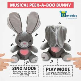 img 2 attached to Анимированная музыкальная плюшевая игрушка Bundaloo Peek-A-Boo Bunny - подвижные гибкие уши и светящееся сердце - играет Peek-A-Boo и поет Do Your Ears Hang Low - интерактивный серый поющий плюшевый кролик для мальчиков и девочек