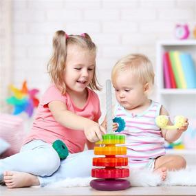 img 2 attached to 🌈 Rainbow Spinning Stacking Tower - Ollie & Olive Learn & Play - Educational Toy for Toddlers and Babies 12 Months+ - Promotes Hand-Eye Coordination - Gender-Neutral Learning Toy for Boys and Girls