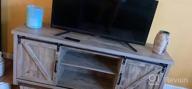 img 1 attached to Rustic Gray Wash Catrimown Farmhouse TV Stand With Sliding Barn Door For 65 Inch TV - Entertainment Center And Media Console Stand For TVs Up To 65+ review by Theresa Brown