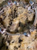 картинка 1 прикреплена к отзыву Женский браслет с бусинами из муранского стекла и подвесками в виде 🦋 единорога, бабочки и цветка - идеальный вариант подарка от Luis Shreibman