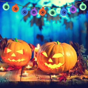 img 1 attached to Жутко и весело: осветите свой декор на Хэллоуин с помощью 30 светодиодных гирлянд для глаз ILLUMINEW - водонепроницаемые, 8 режимов, дистанционное управление и питание от батареек!