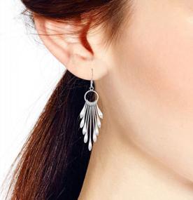 img 1 attached to Make A Statement With Shimmering Fan Sterling Silver Dangle Earrings From AeraVida, 0.79X2.28 In