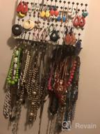 img 1 attached to Black Wall Mounted Jewelry Organizer With 117 Holes And 12 Hooks For Earrings, Necklaces, And Bracelets - Display Hanger By JackCubeDesign (16.54 X 12.2 X 0.75 Inches) review by Kelly Hall