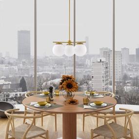 img 1 attached to Linea Di Liara Satin Brass Modern 3 Light Globe Chandelier - Caserti Mid Century Clear Glass Ceiling Light For Kitchen, Dining Room And Hallways