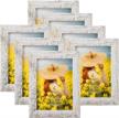 set of 7 distressed rustic picture frames by petaflop - display your 5x7 photos on wall or tabletop with style logo