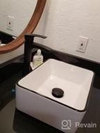 img 1 attached to Black And White Ceramic Bathroom Sink, Above Counter Porcelain Vessel Sink With Black Faucet And Pop Up Drain Combo, Round review by Nicholas Peters